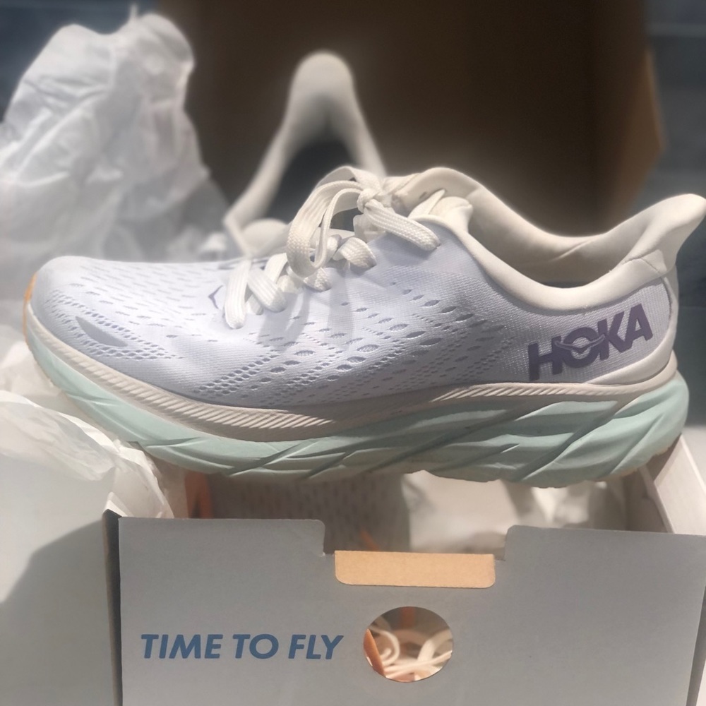 Hoka Clifton shoe, slightly worn.